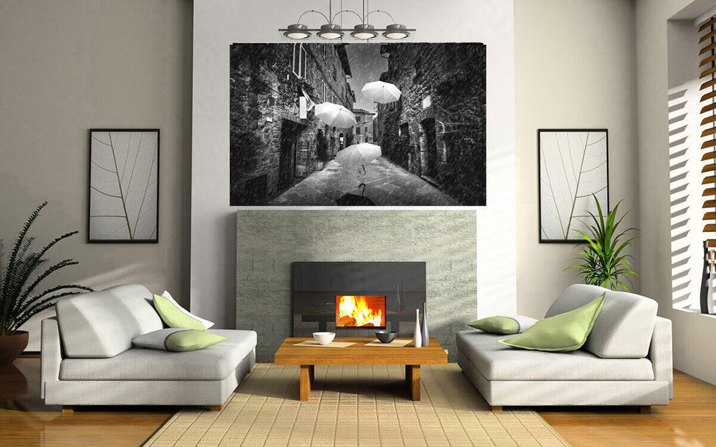 Flying black white umbrellas in street in Tuscany Canvas Wall Art Picture Print
