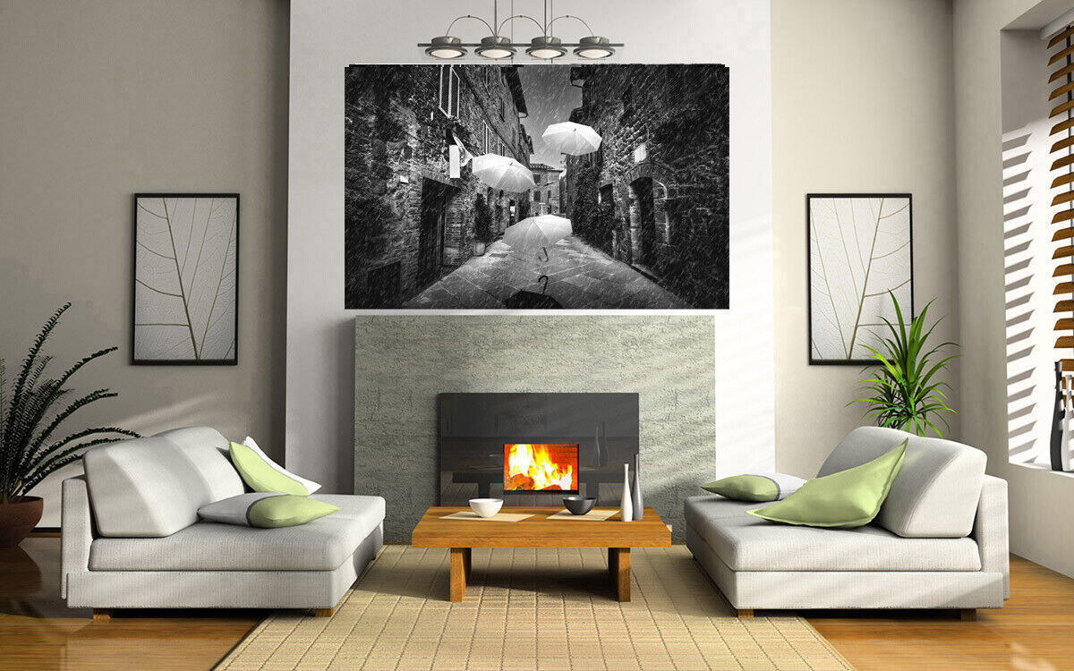 Flying black white umbrellas in street in Tuscany Canvas Wall Art Picture Print