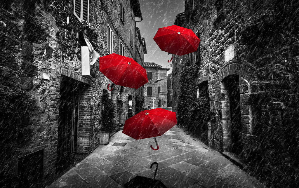 Flying red umbrellas in street in Tuscany Canvas Wall Art Picture Print