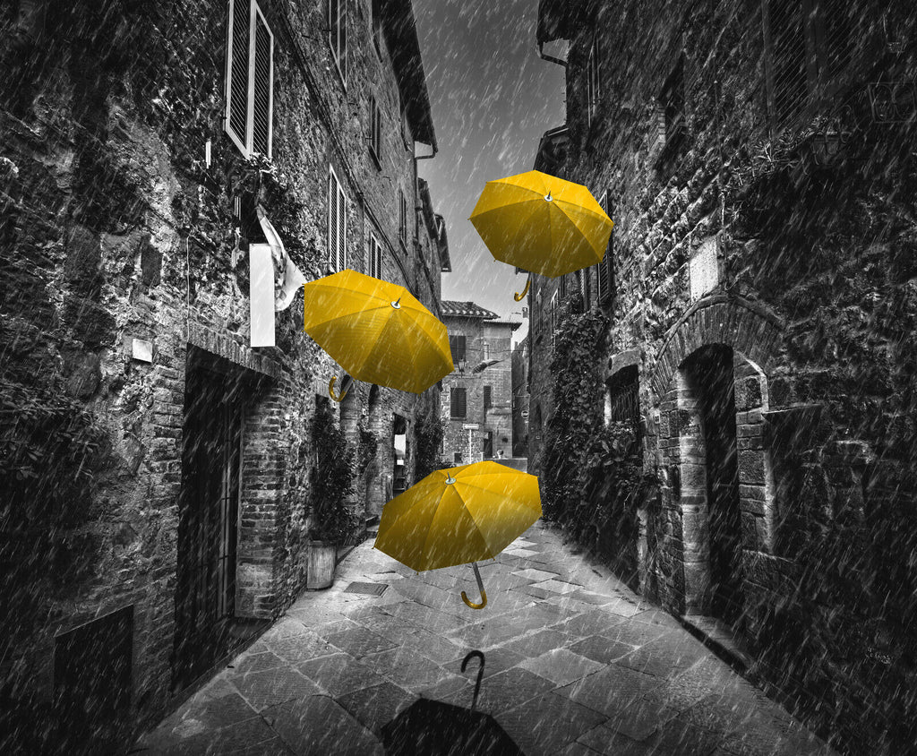 Flying yellow umbrellas in street in Tuscany Canvas Wall Art Picture Print