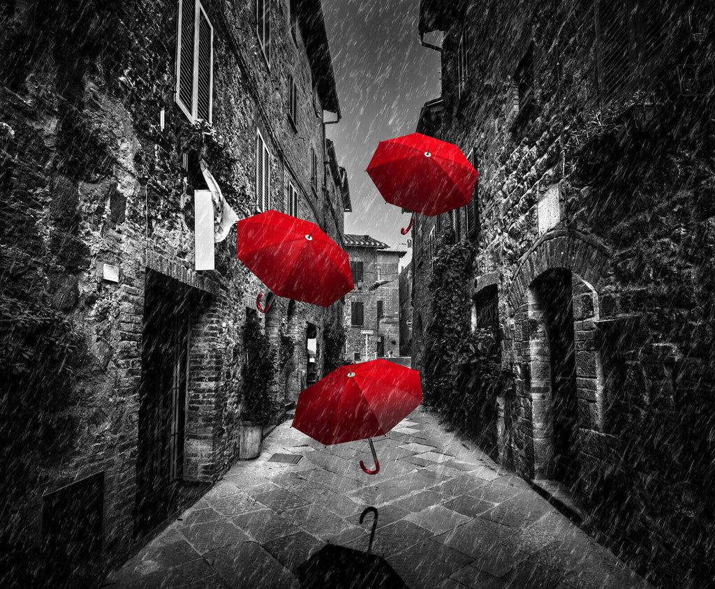 Flying red umbrellas in street in Tuscany Canvas Wall Art Picture Print