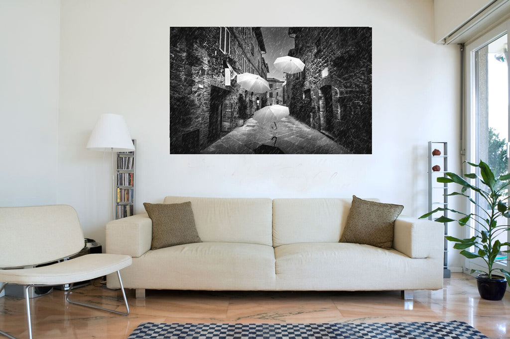 Flying black white umbrellas in street in Tuscany Canvas Wall Art Picture Print