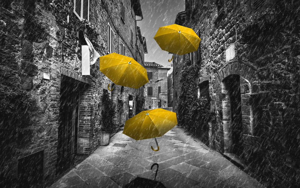 Flying yellow umbrellas in street in Tuscany Canvas Wall Art Picture Print