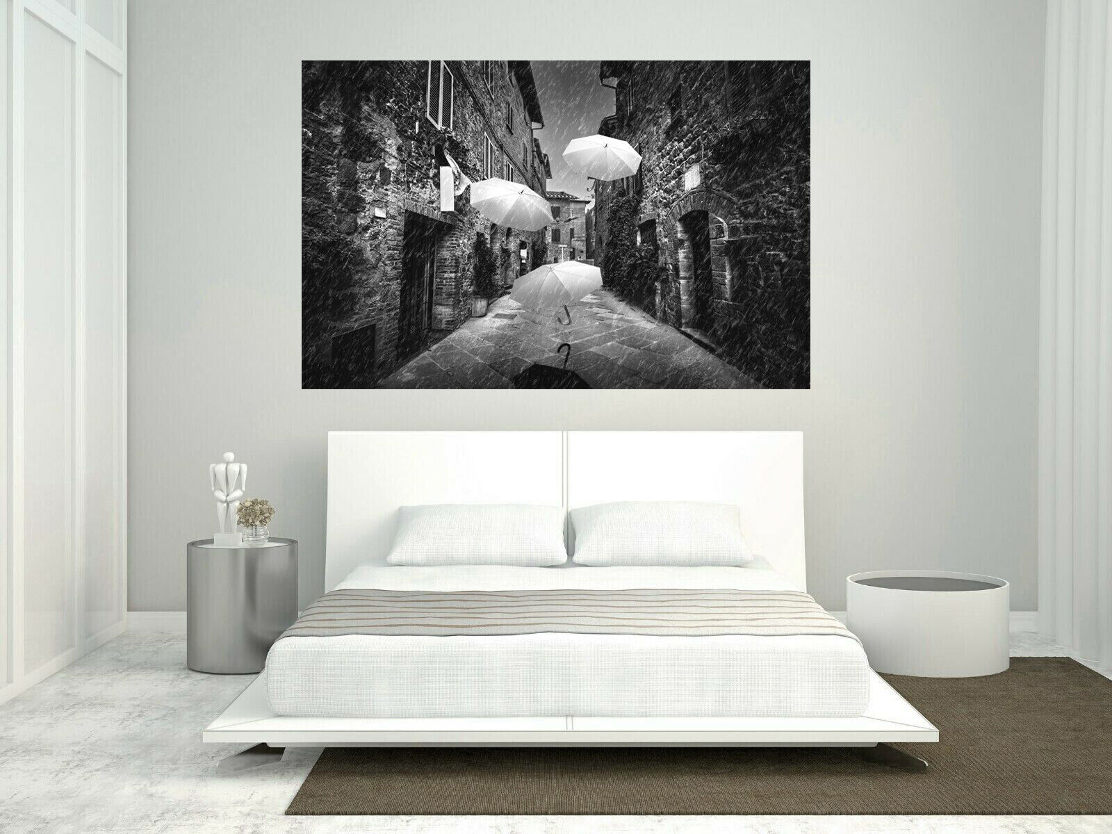 Flying black white umbrellas in street in Tuscany Canvas Wall Art Picture Print