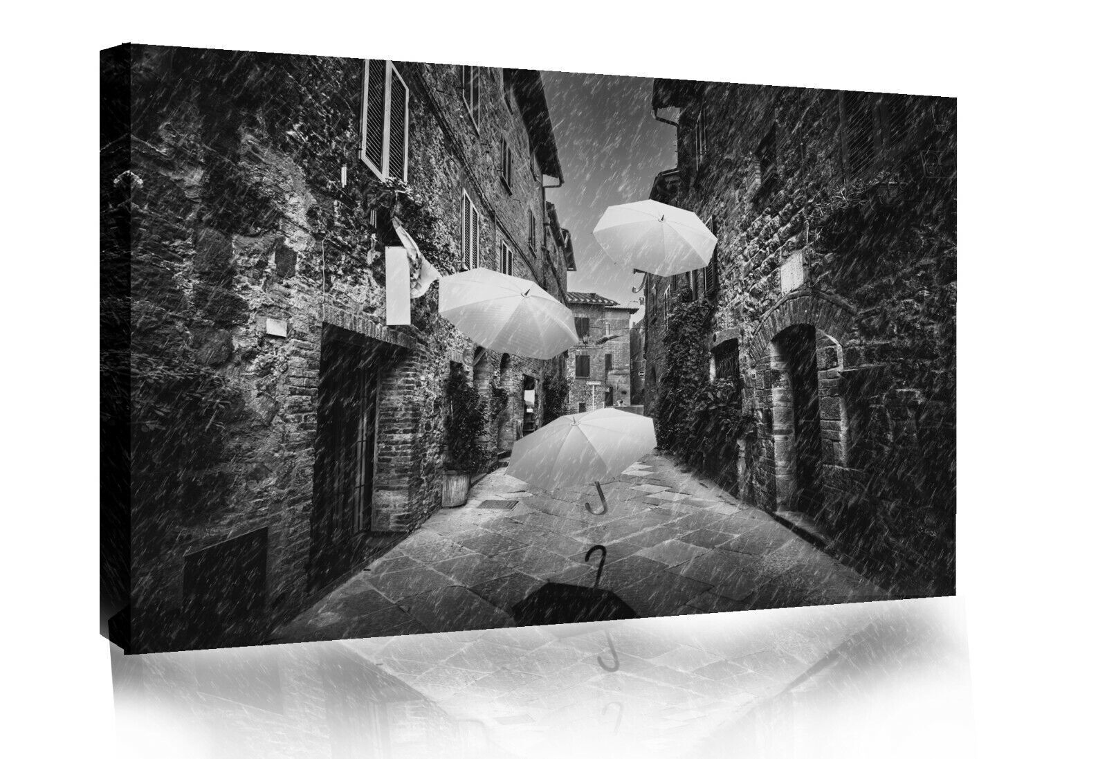 Flying black white umbrellas in street in Tuscany Canvas Wall Art Picture Print